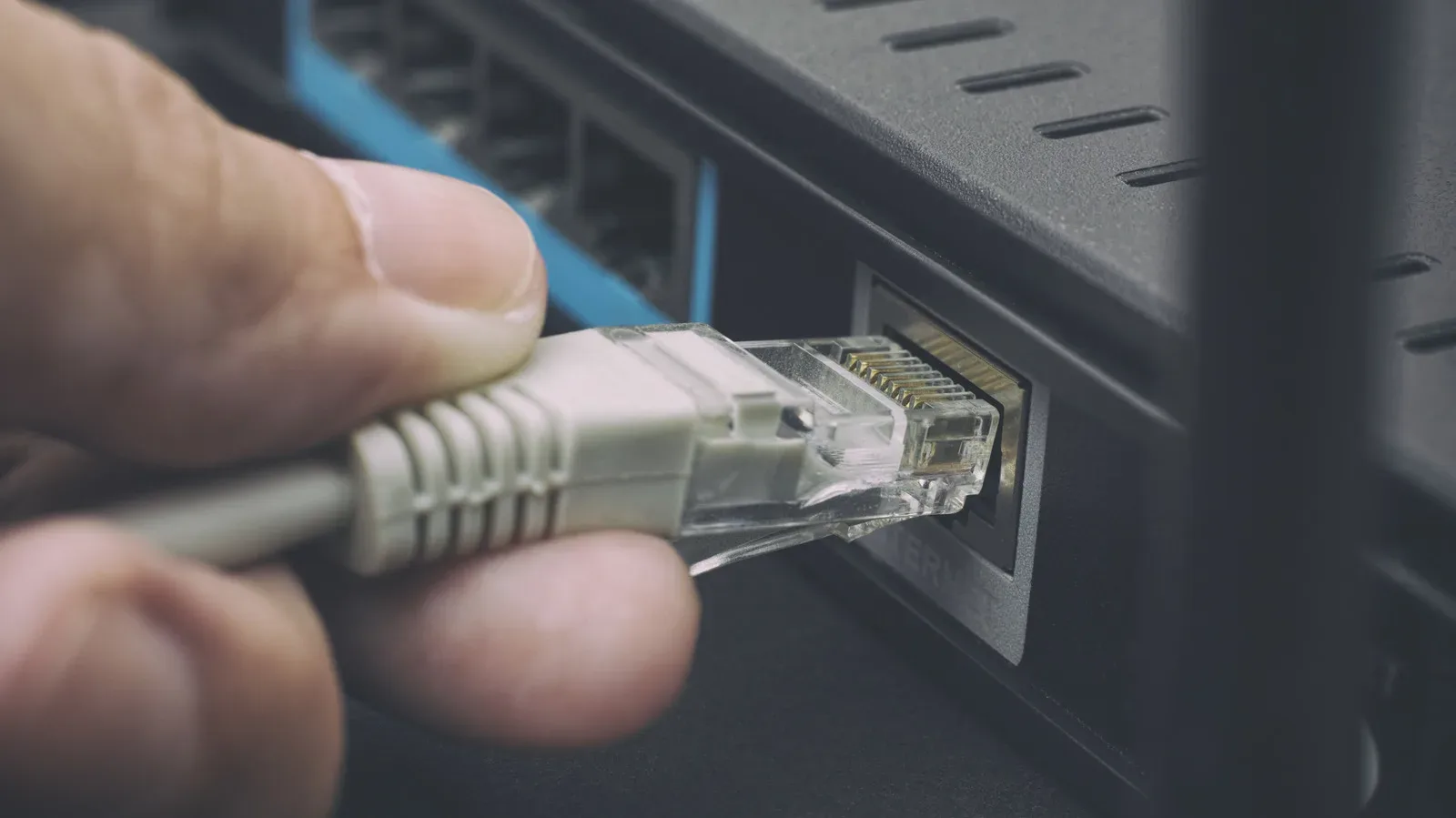 Router rear panel showing WAN Internet port and multiple LAN Ethernet ports