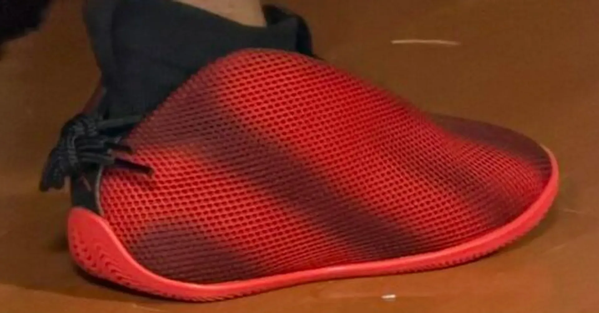 Jordan Brand VP Global Footwear Dominique Debnam wearing the red and black Jordan Vail at a Detroit footwear forum