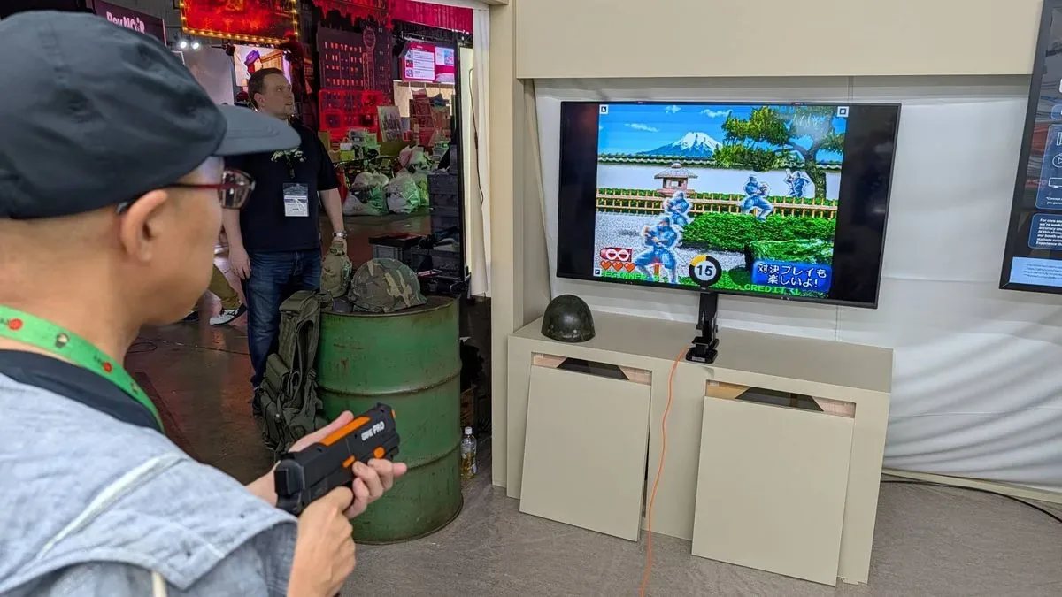 G'AIM'E Lightgun Pro prototype at Tokyo Game Show with USB-C cable connected to console.