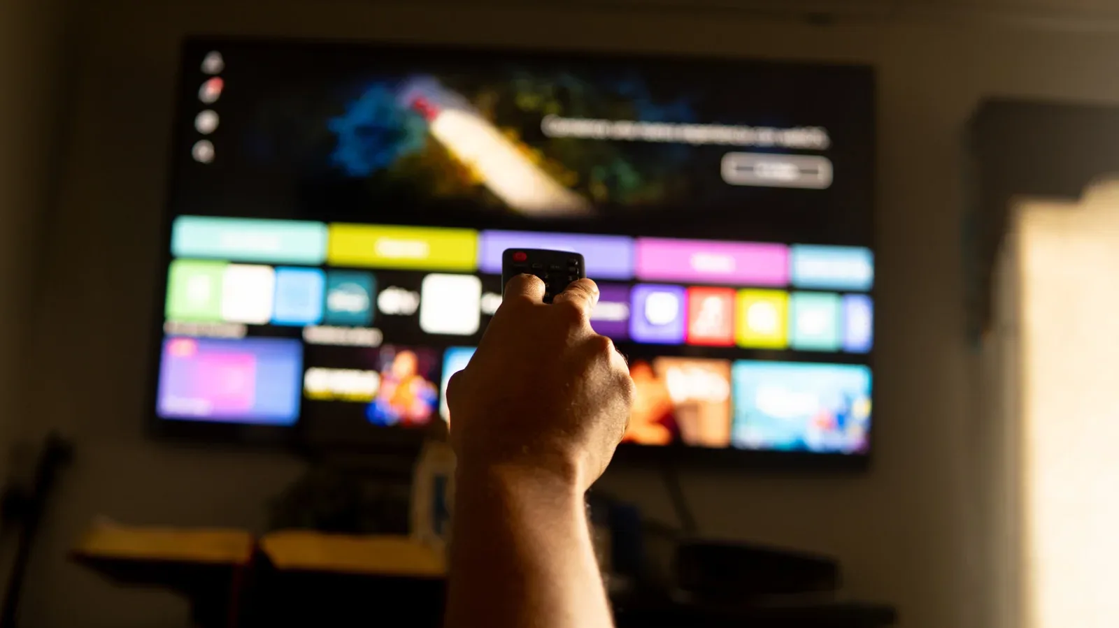 Smart TV home screen showing free ad-supported streaming apps and live channel guides