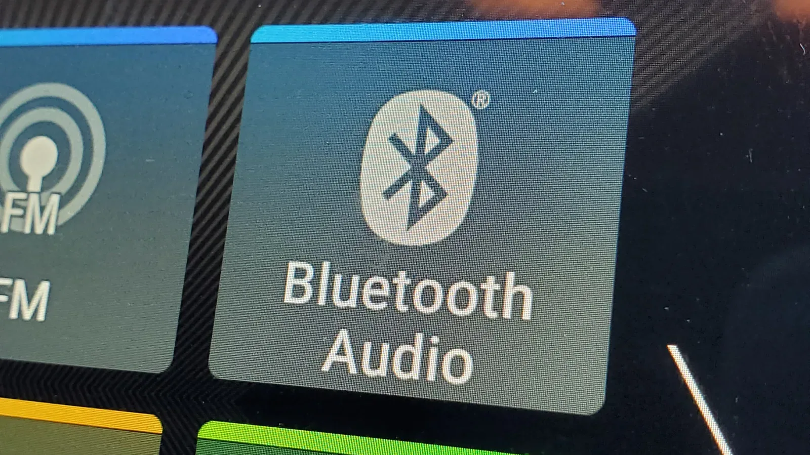 A smartphone Bluetooth settings screen beside wireless earbuds and a game controller
