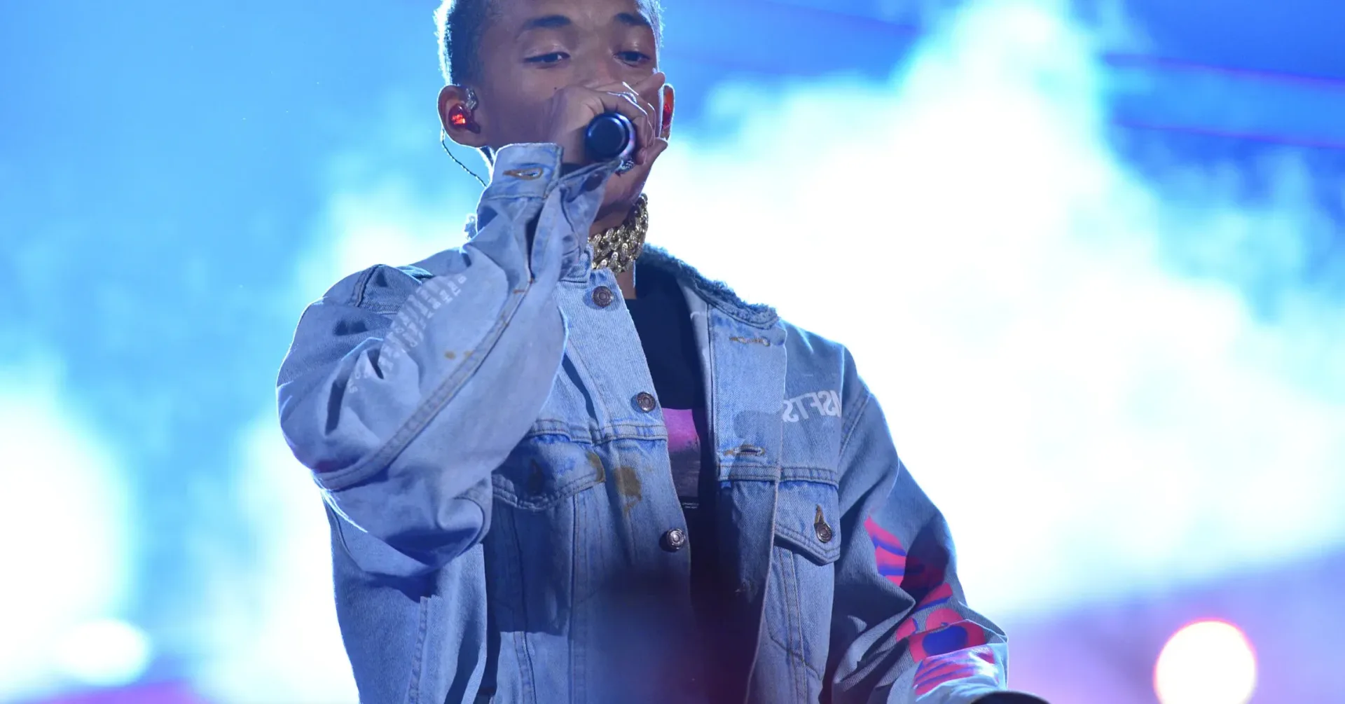 Jaden Smith wearing a Christian Louboutin backpack with multiple labeled front pockets