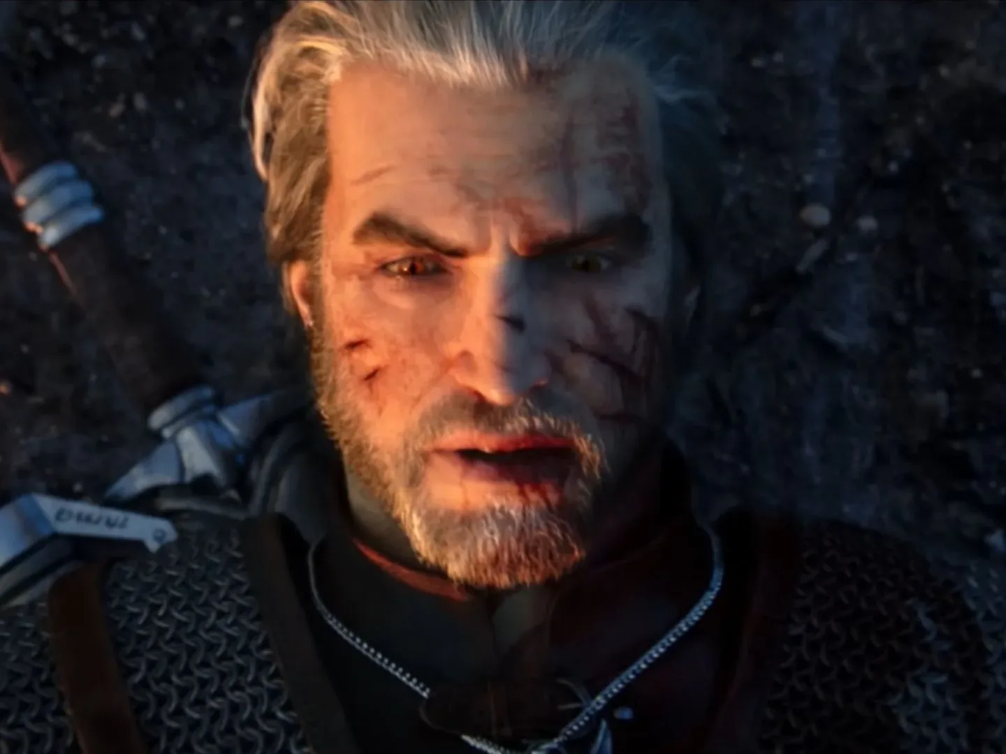 Geralt with a bloody lip lies on the ground