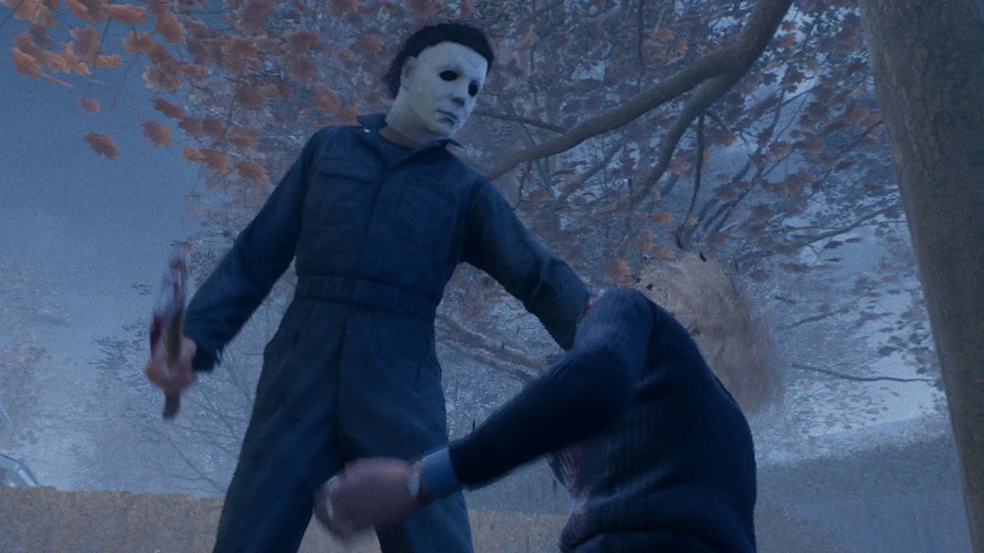 Michael holds a hatchet over Laurie as she kneels on the ground in front of him in Halloween the Game.