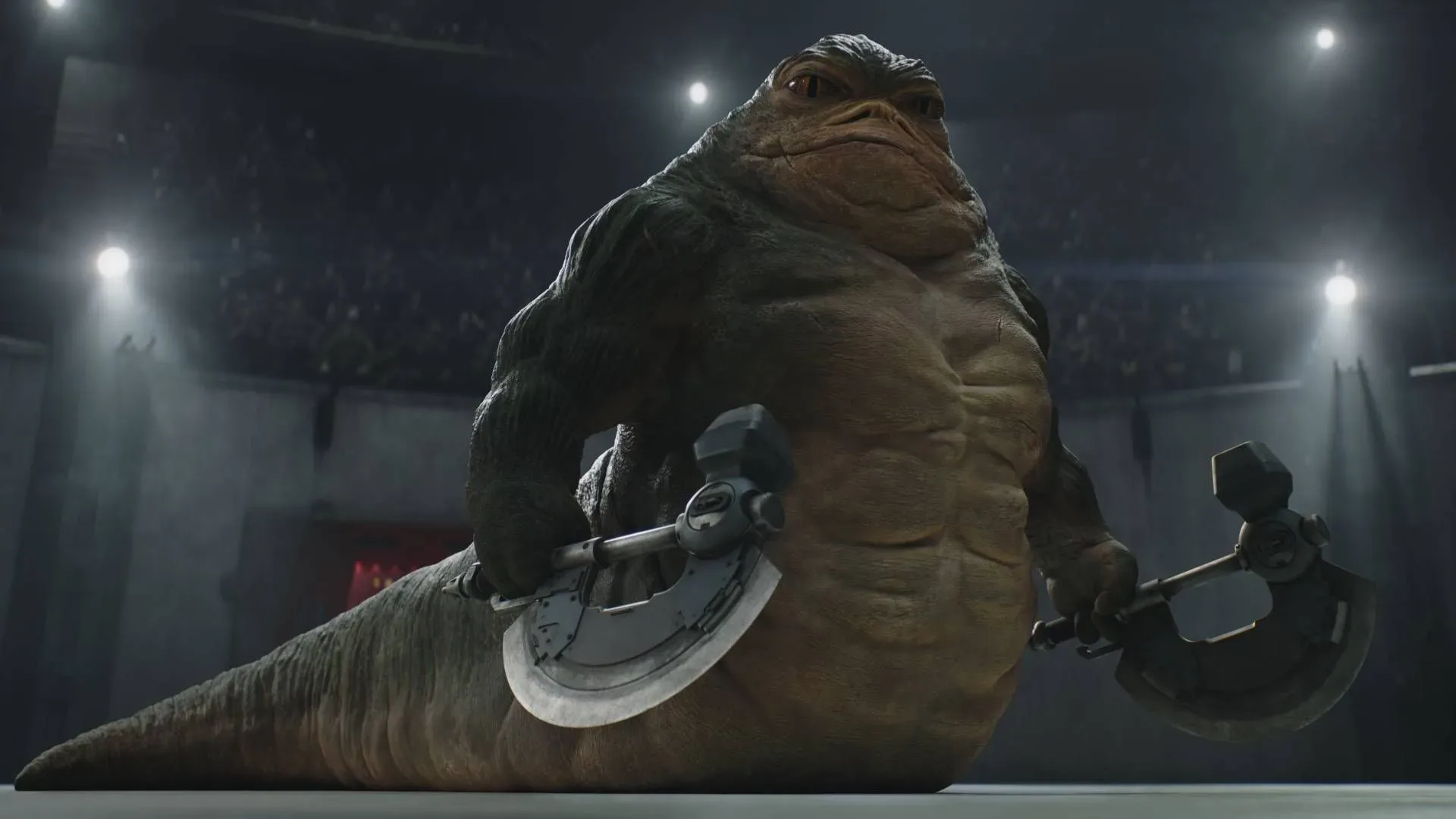 Din Djarin faces Rotta the Hutt during a gladiatorial-ring fight