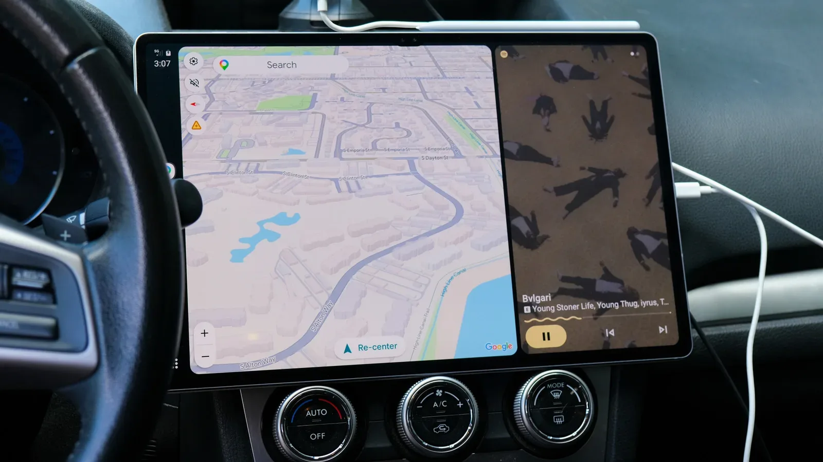 Android tablet displaying a car-friendly Android Auto interface on a dashboard