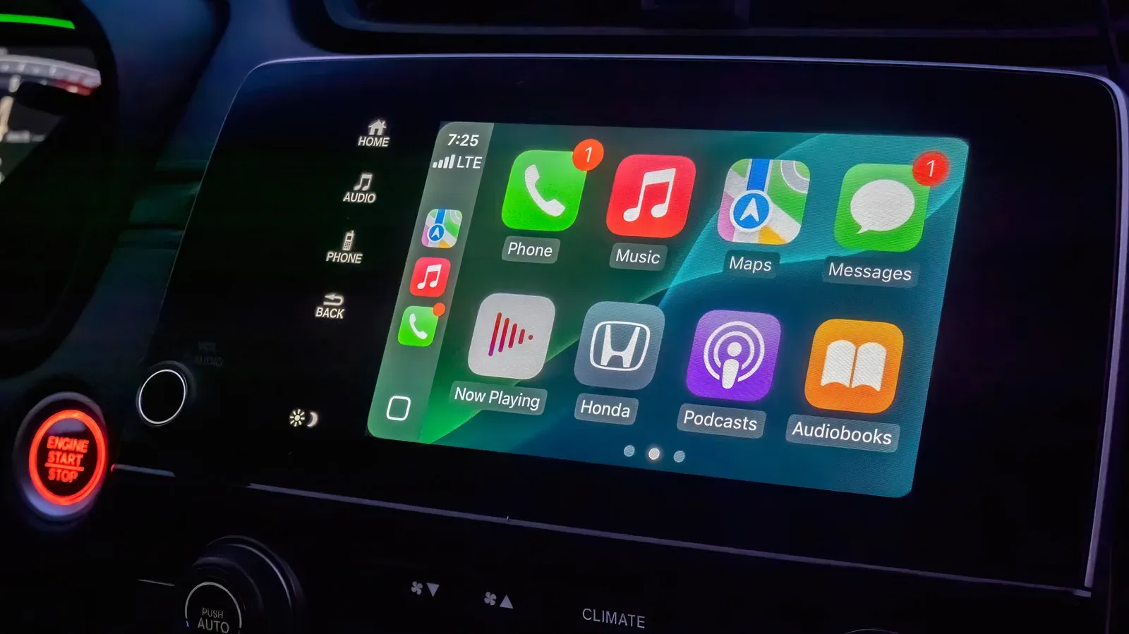 Apple CarPlay dashboard showing app icons and navigation controls