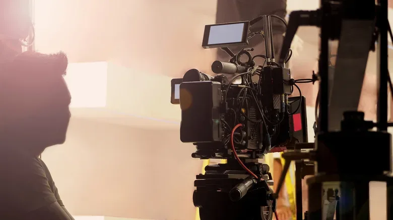Diagram-style view of 65mm IMAX film running horizontally through a camera
