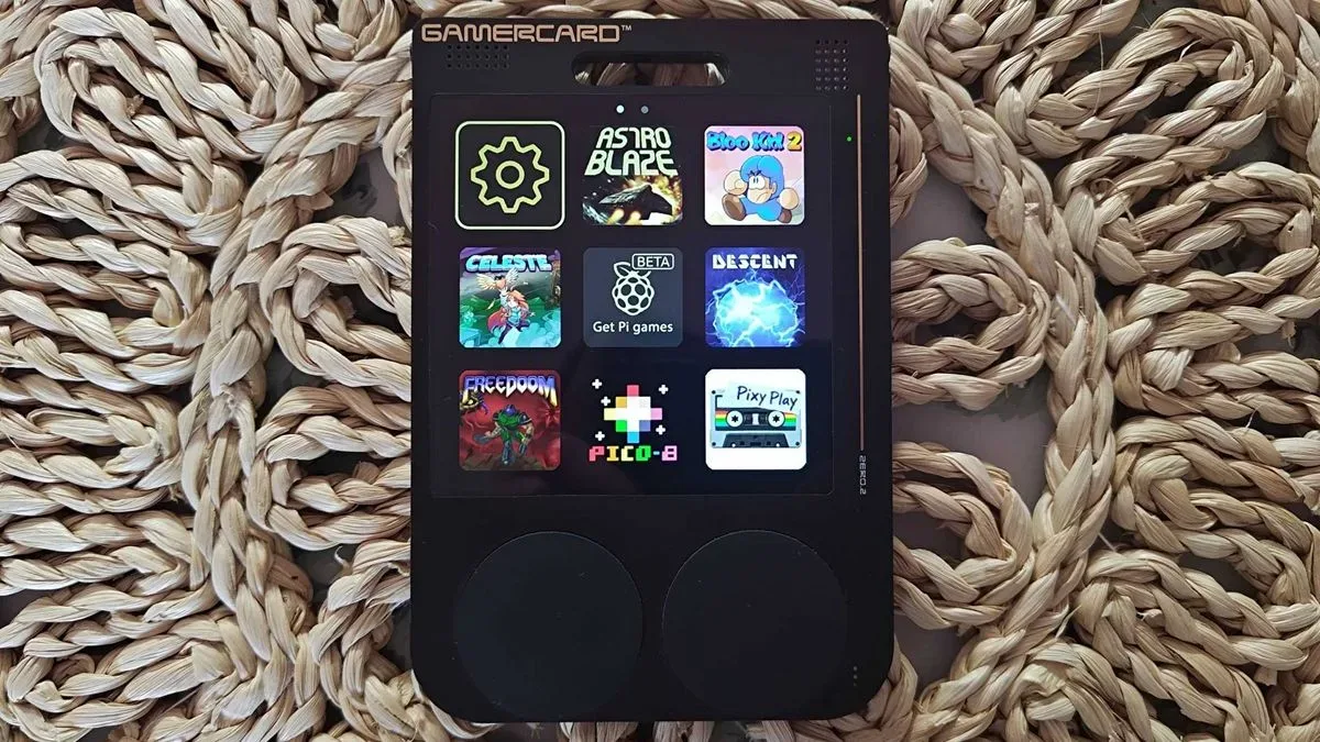Gamercard ultra-thin Raspberry Pi handheld with exposed black and gold circuit-board construction