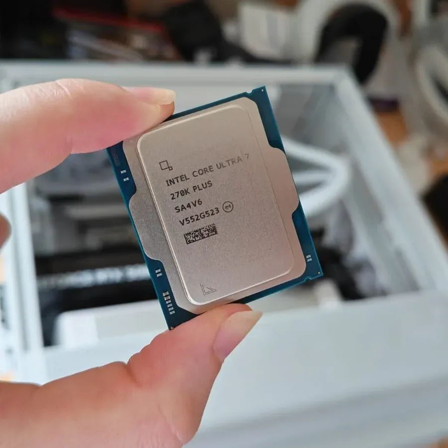 A reviewer holding the Intel Core Ultra 7 270K Plus