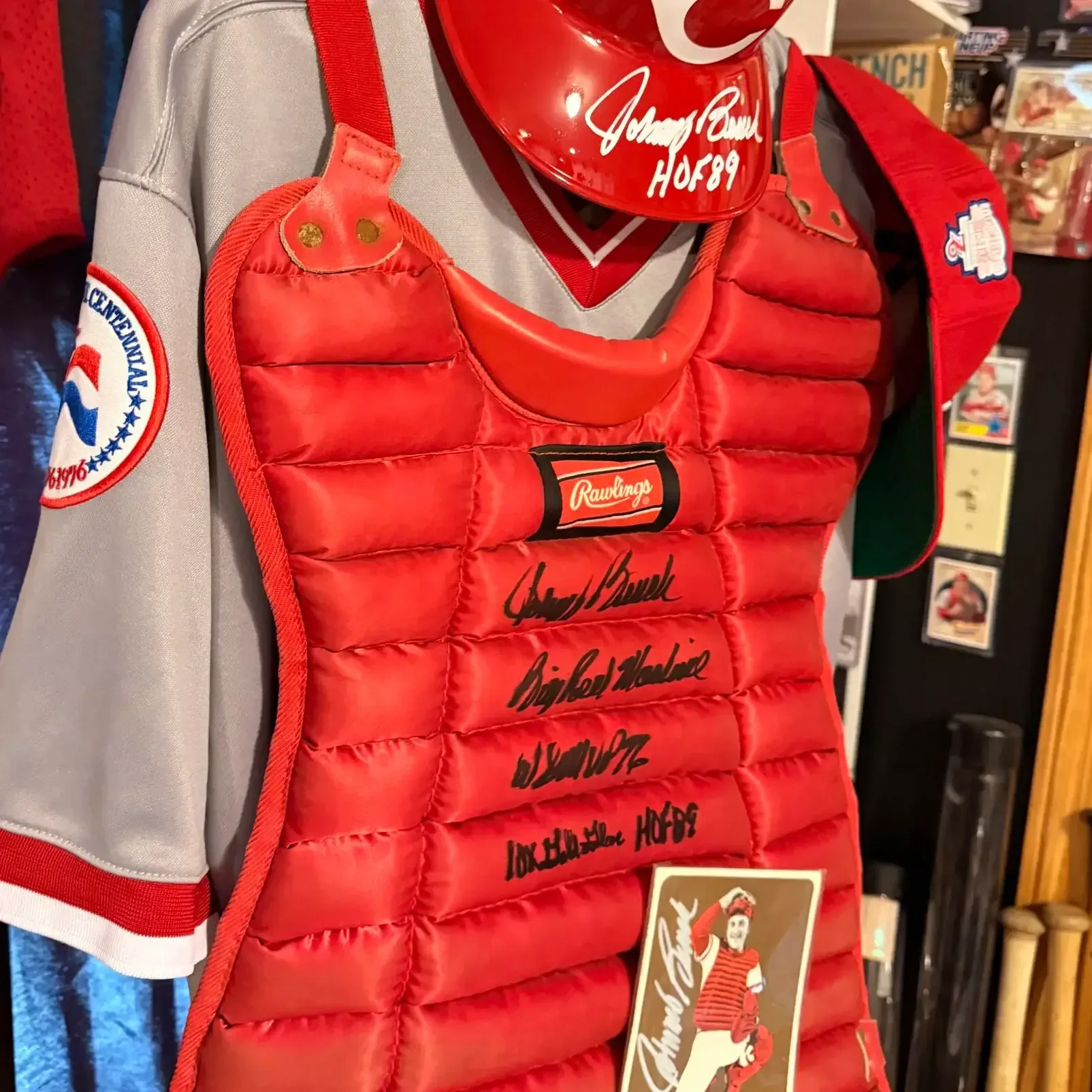Vintage Cincinnati Reds collectibles displayed alongside Johnny Bench photographs