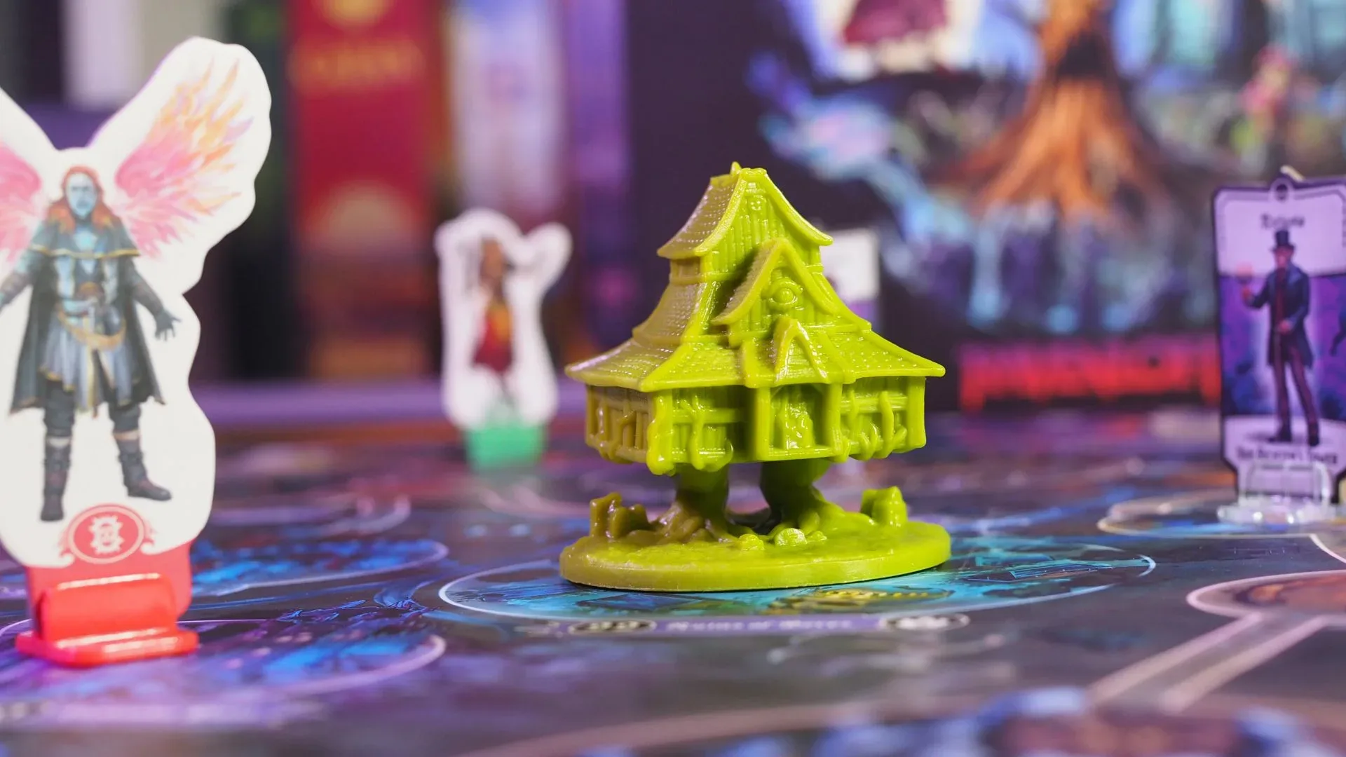 A Halloween tabletop game night with horror board game boxes, cards and dice on a table