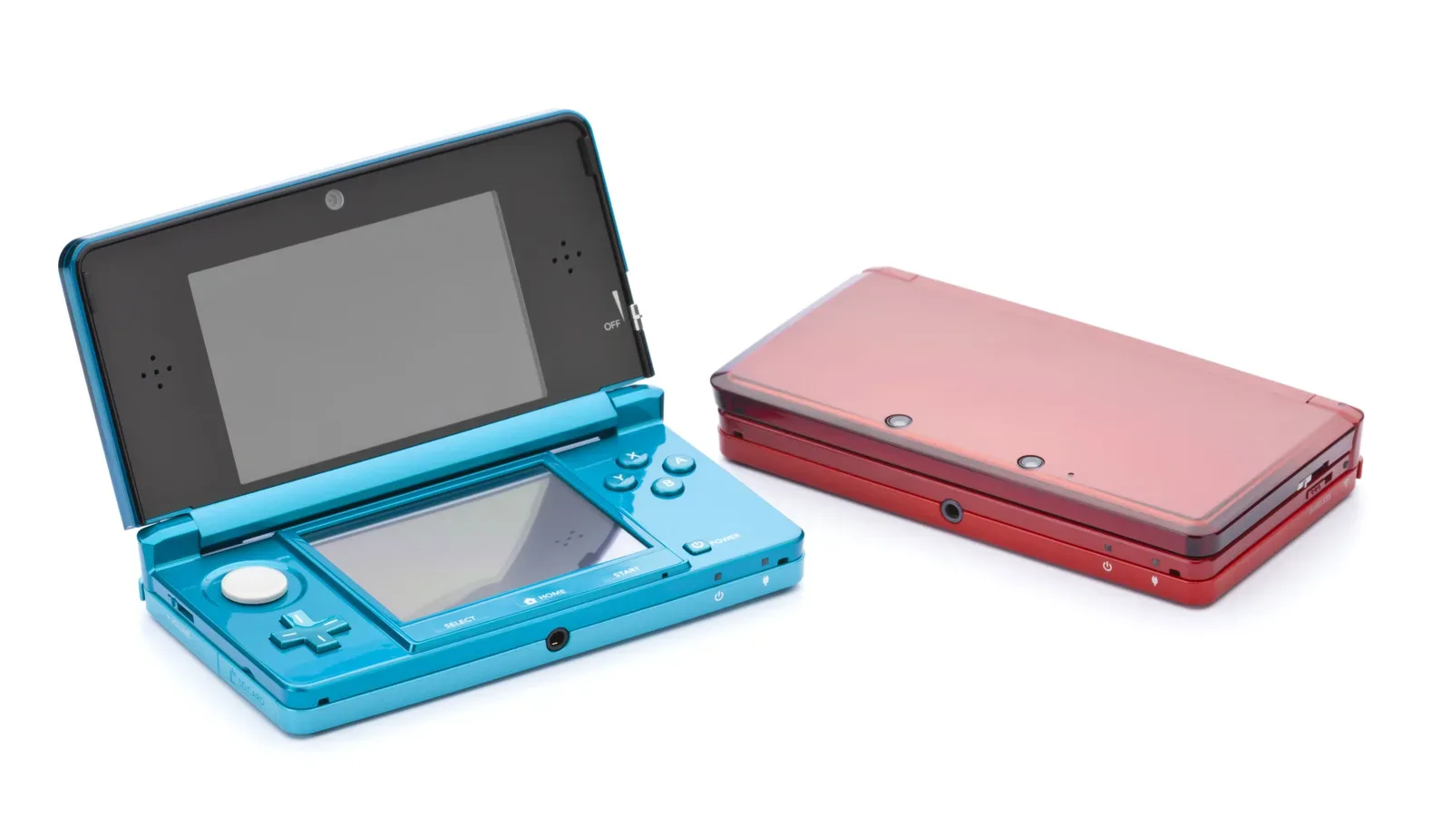 A closed Nintendo 3DS clamshell handheld resting beside physical game cartridges