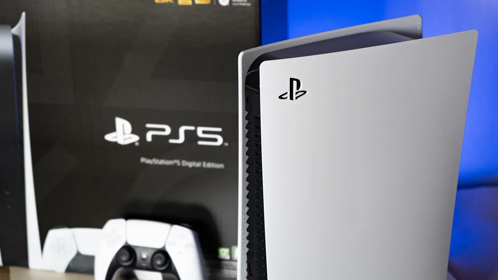 A PlayStation 5 console beside a 4K Blu-ray case