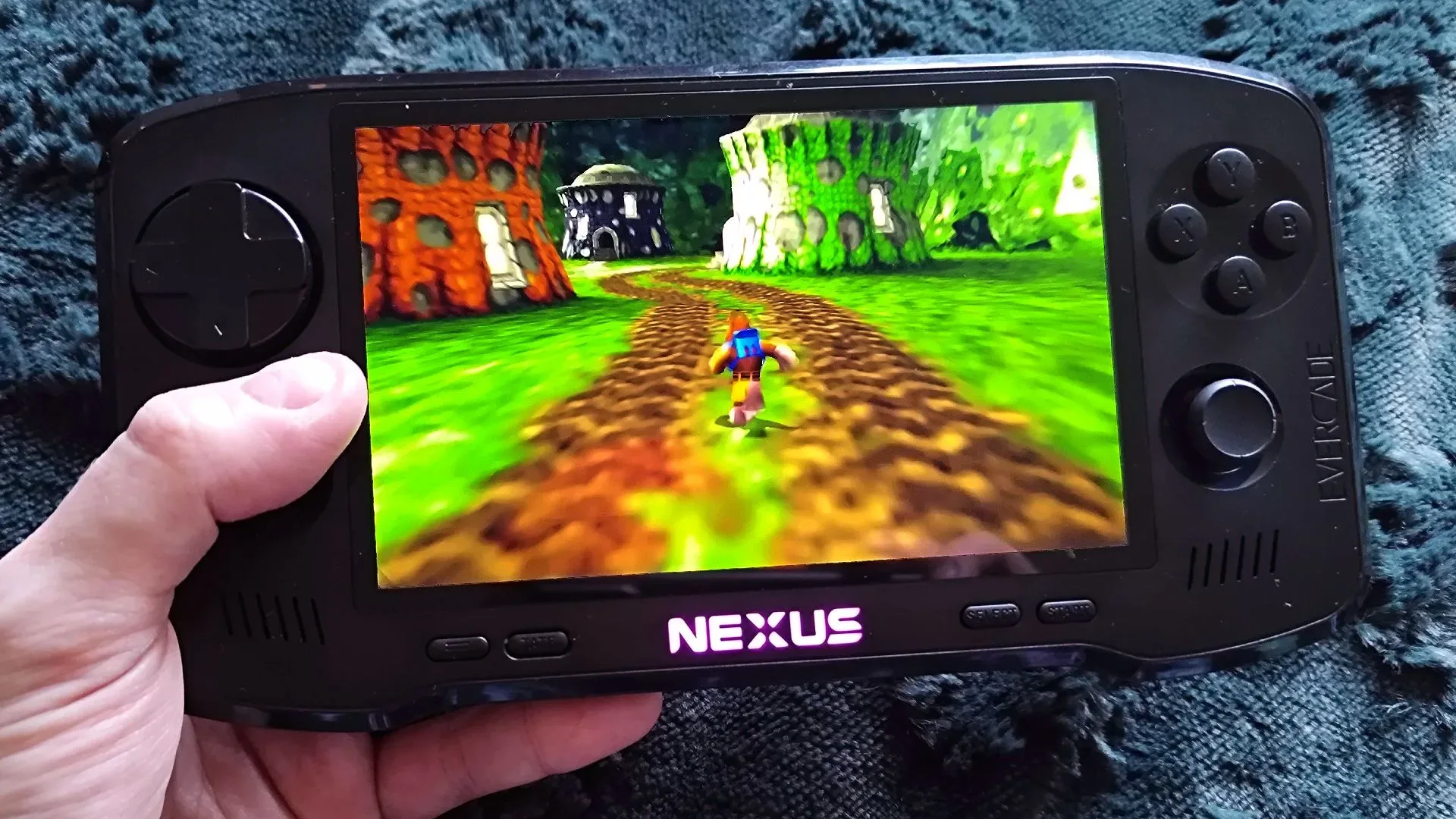 Evercade Nexus handheld showing its dual-thumbstick control layout