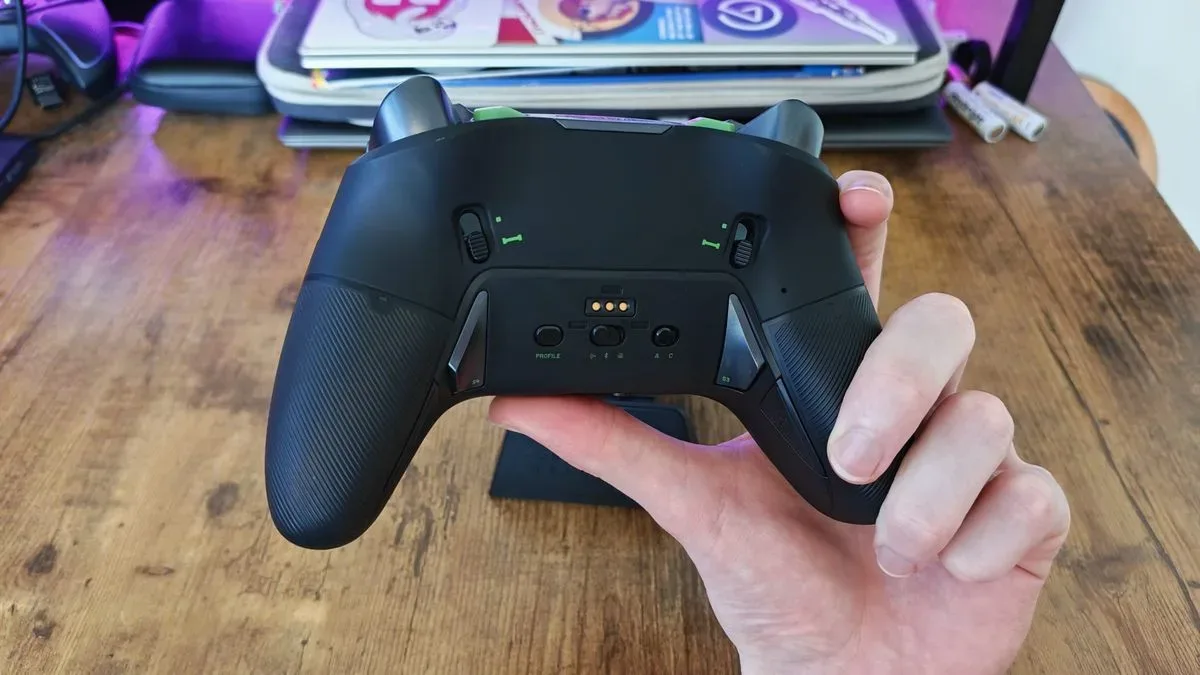 A reviewer showing the back of the Nacon Revolution X Unlimited