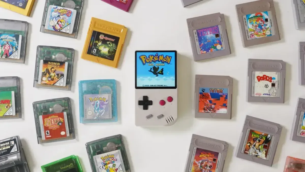 FunnyPlaying FPGB Mini FPGA handheld with a Game Boy cartridge inserted