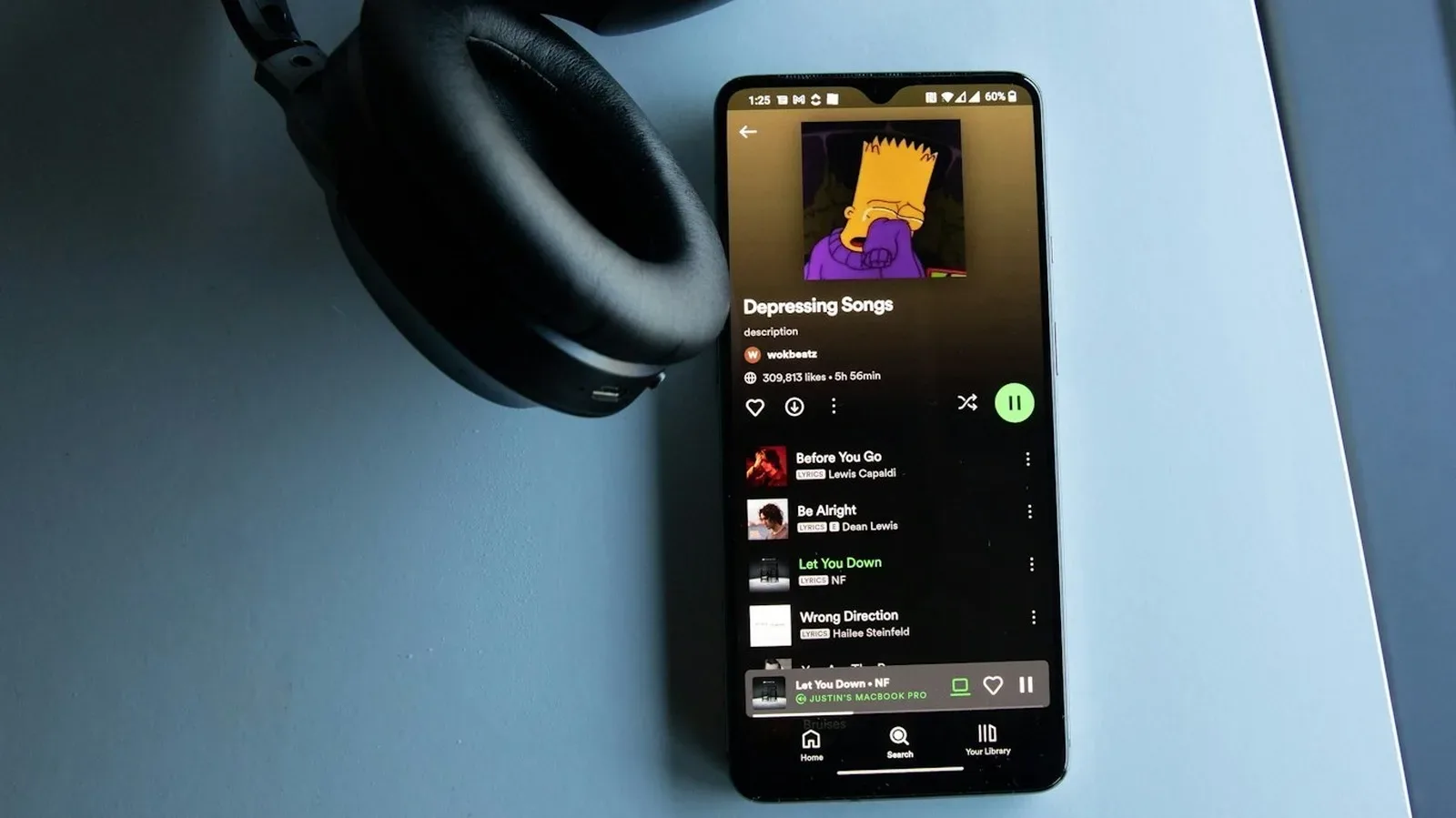Spotify music recommendation screen illustrating AI-generated audio labels and spam filtering