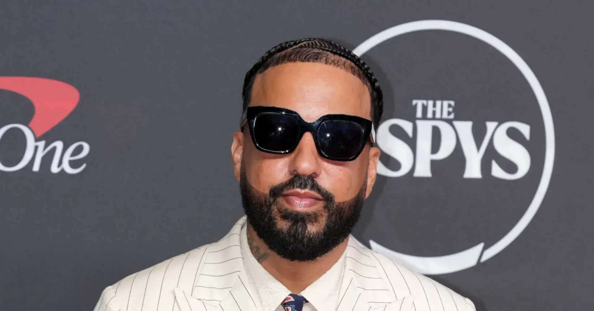 French Montana at a crowded fashion convention marketplace
