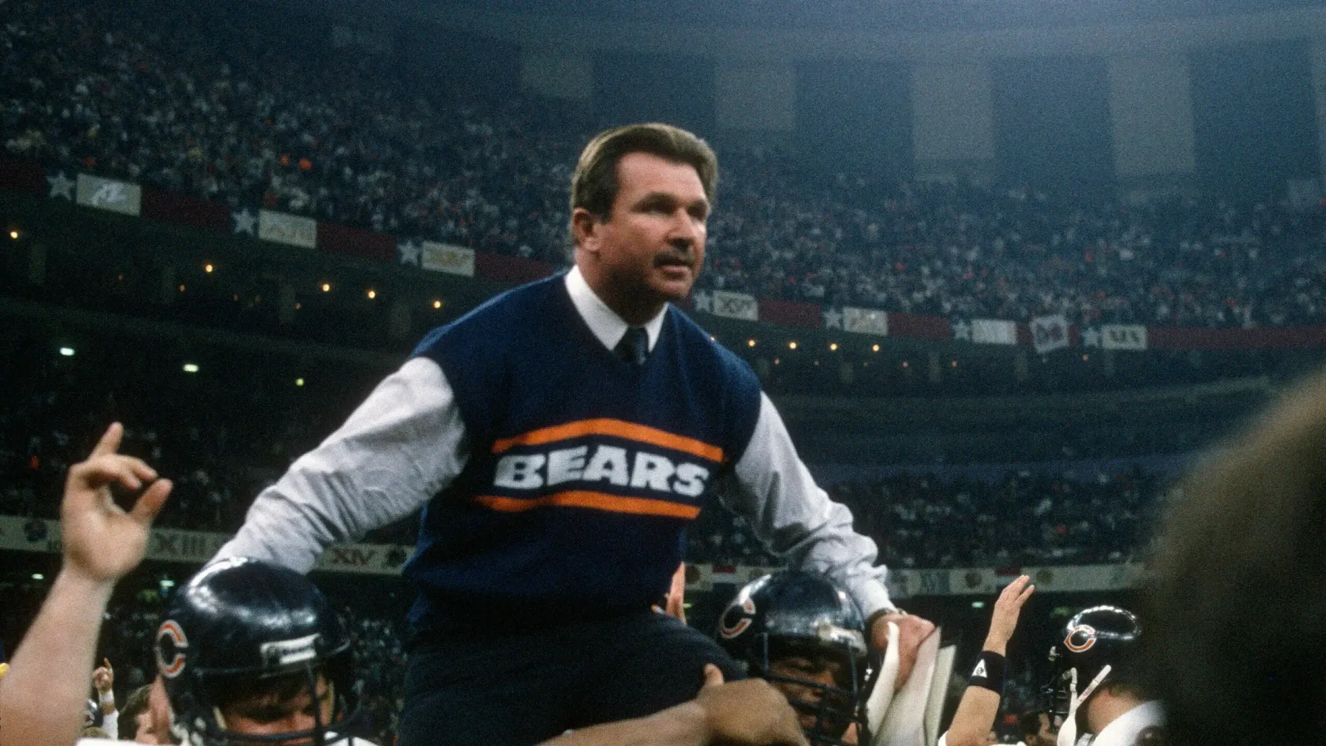 Mike Ditka being carried off the field after the Chicago Bears won Super Bowl XX