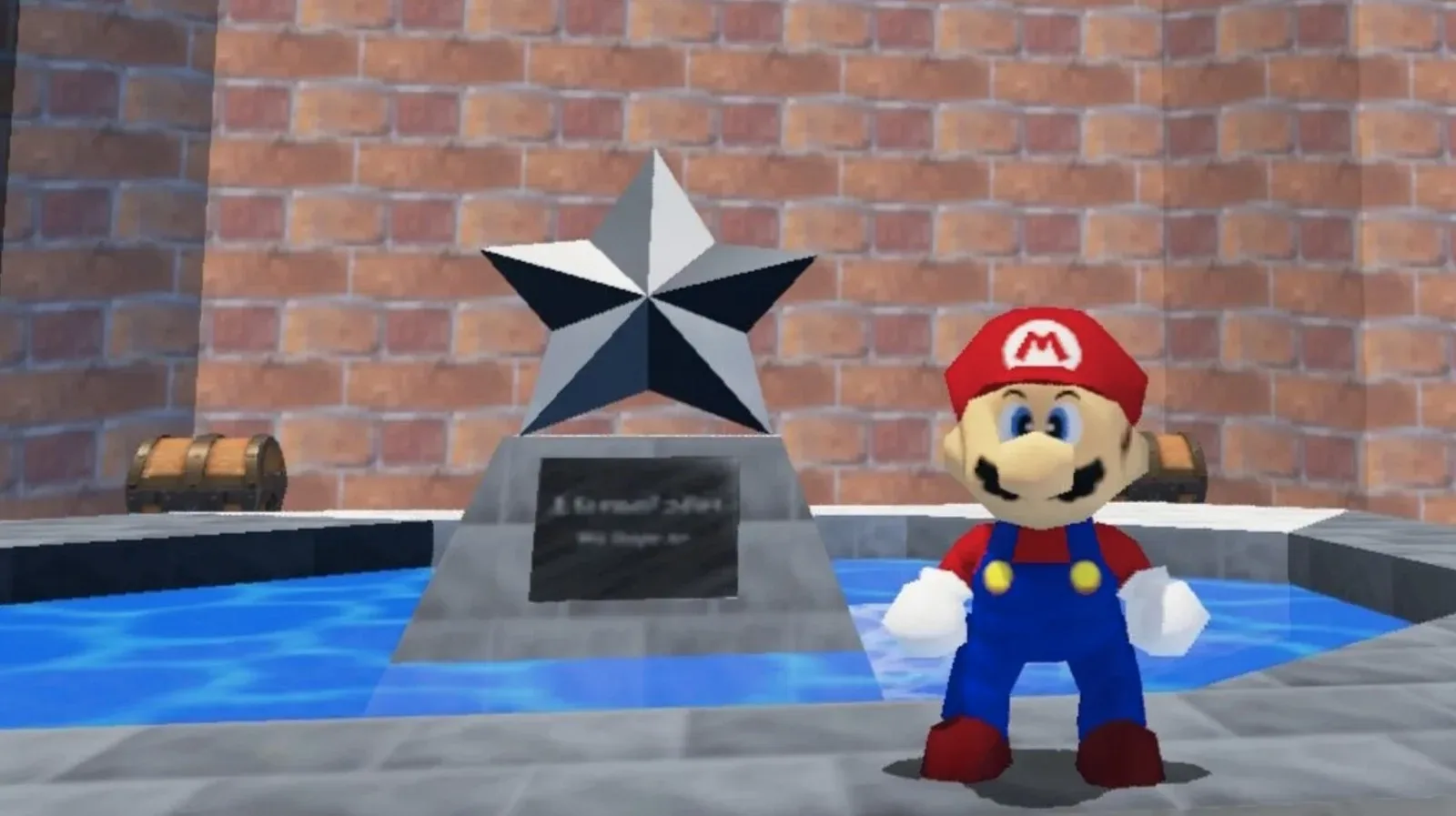 The blurry plaque beneath the giant star statue in Super Mario 64’s castle courtyard