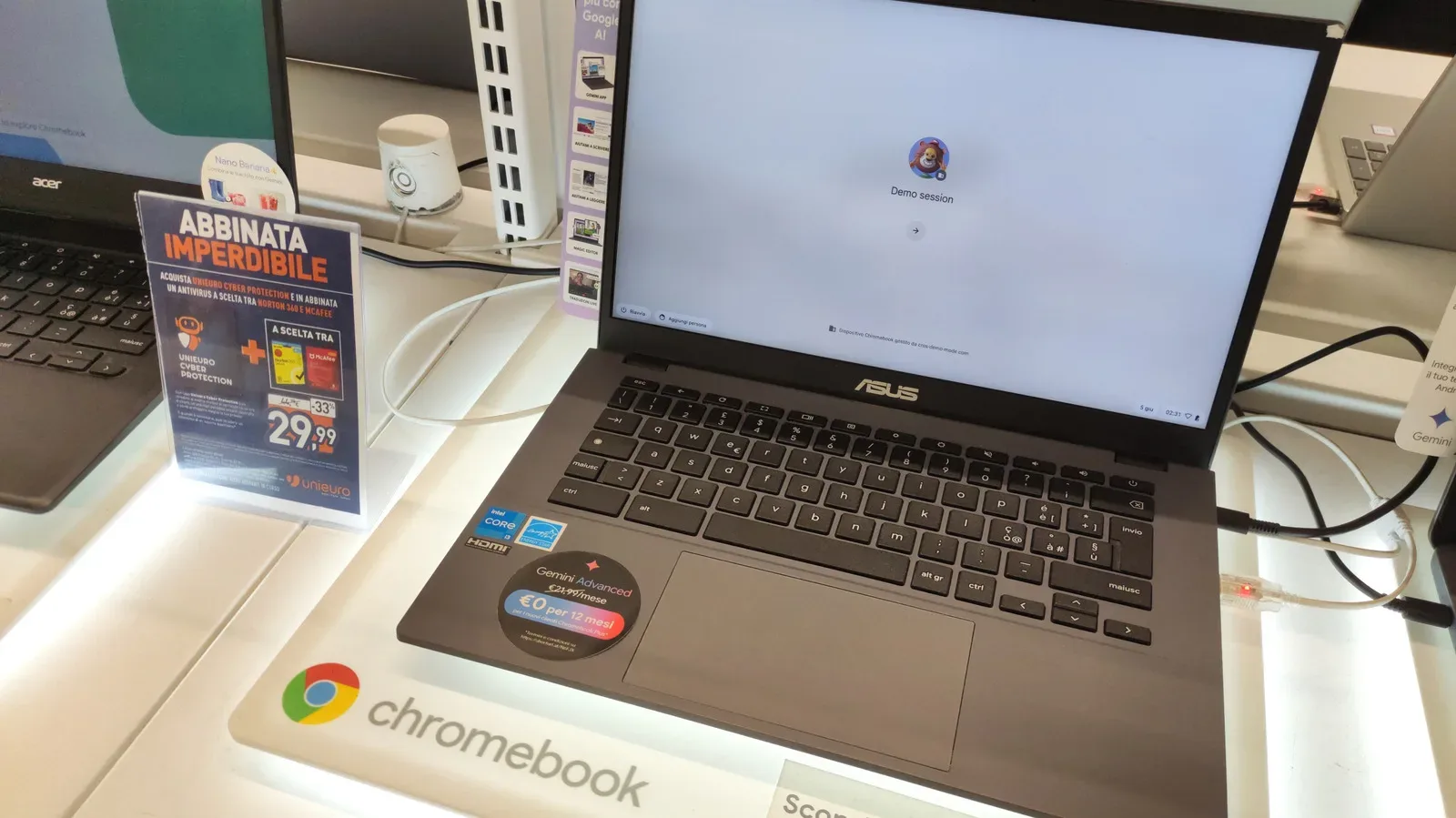 A Chromebook and a Googlebook-style laptop shown side by side on a desk