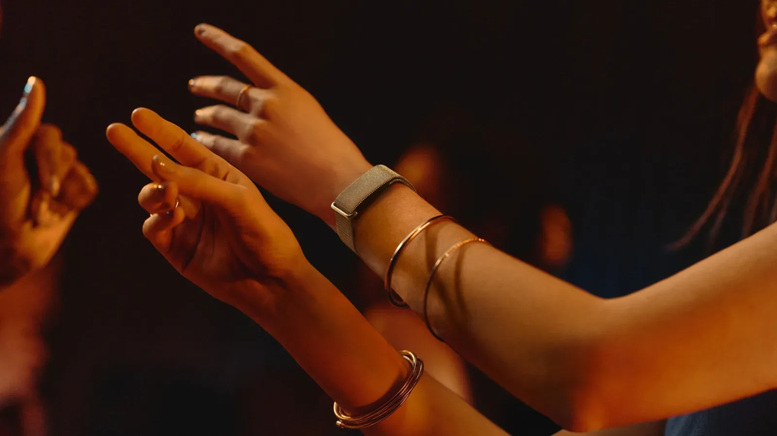 Fitbit Air shown with a woven Metal Mesh band