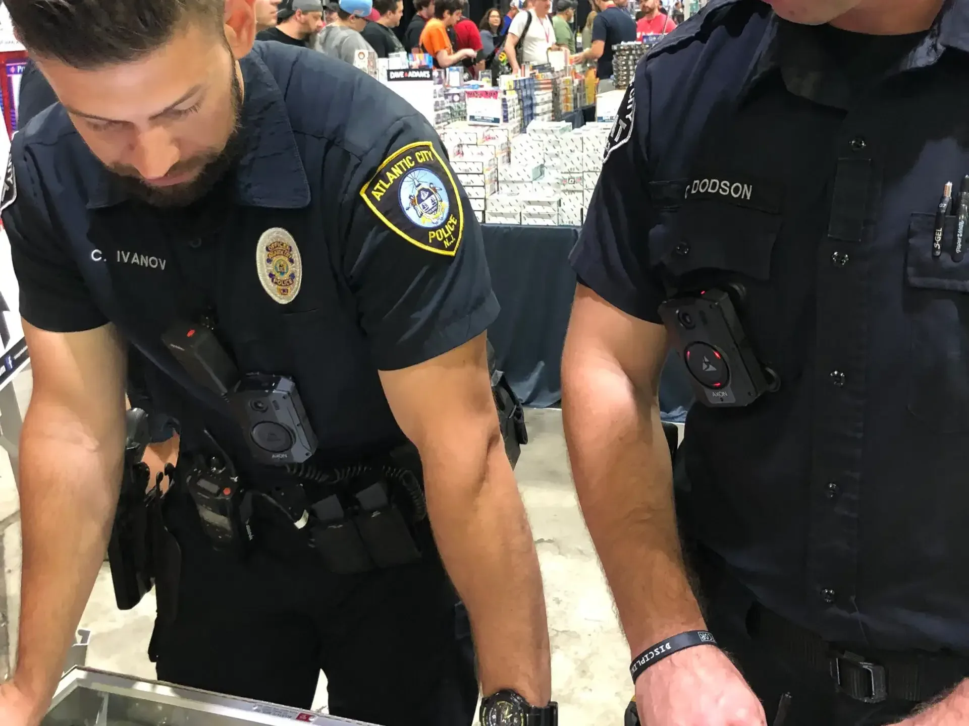 A collector carrying a secured card case through a convention hall