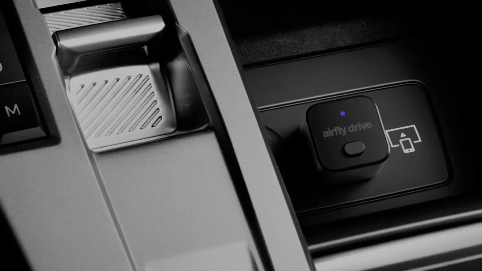 Twelve South AirFly Drive wireless CarPlay adapter connected to a vehicle USB port