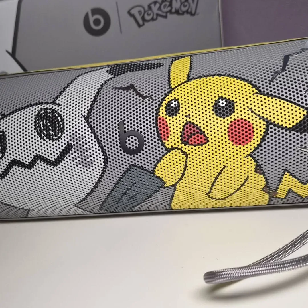 Gray Beats Pill Pokémon edition with a Poké Ball charm attached to its carry strap