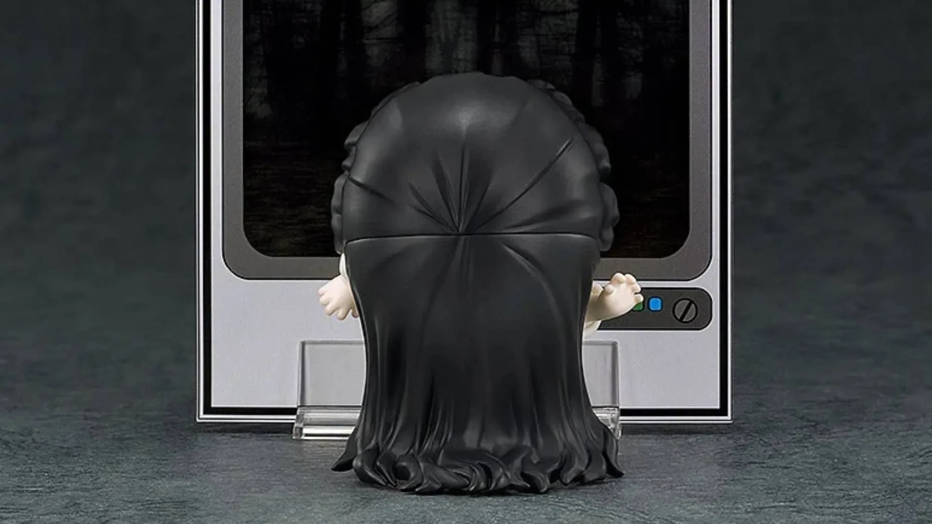 Sadako Ring Nendoroid posed beside its miniature stone well