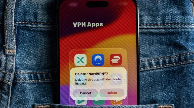 A prompt asking the user to confirm NordVPN app removal on iPhone.