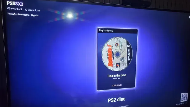 A TV screen showing the UI for the PS5SX2 homebrew software on a PS5. The PS2 disc Burnout Dominator is showing in the OS.