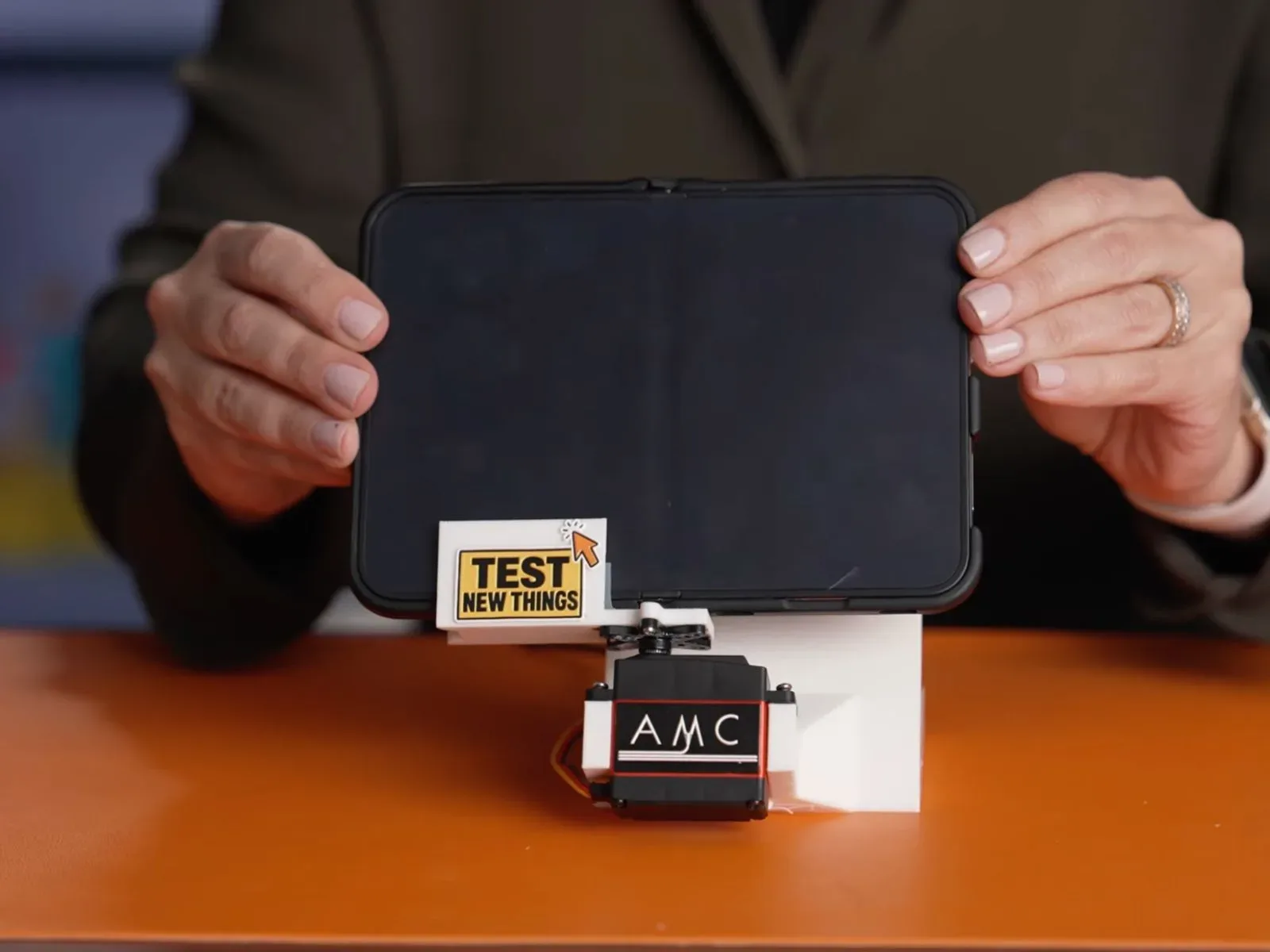 A push-pull gauge measuring resistance on an iPhone Duo hinge
