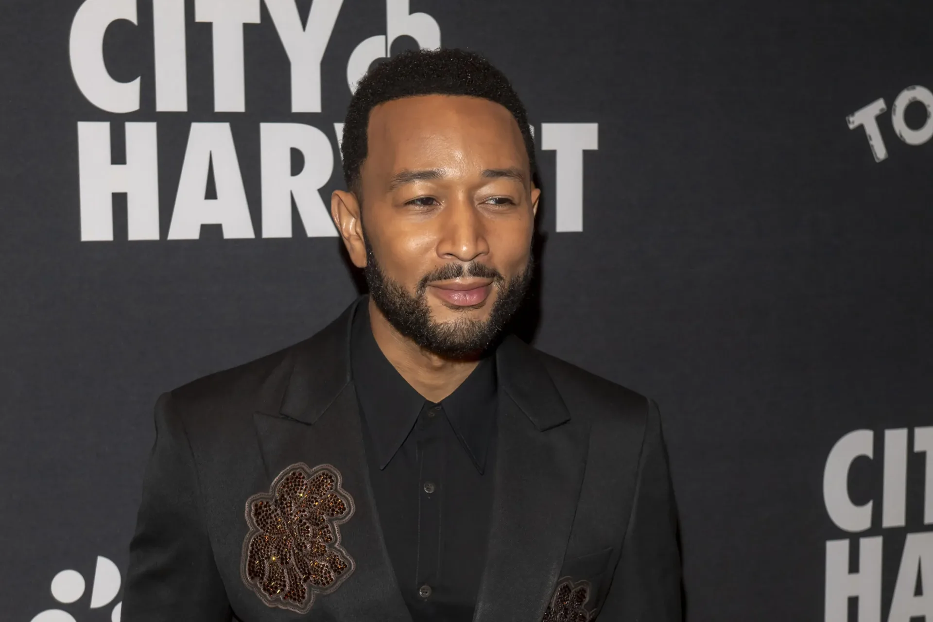 John Legend performing onstage ahead of the release of Muse