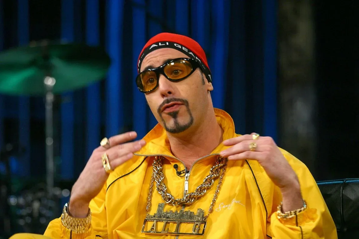 Sacha Baron Cohen in Ali G costume surrounded by look-alikes during a London promotional event