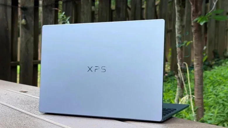 The 2026 Dell XPS 13 with the lid open, viewed from the rear.