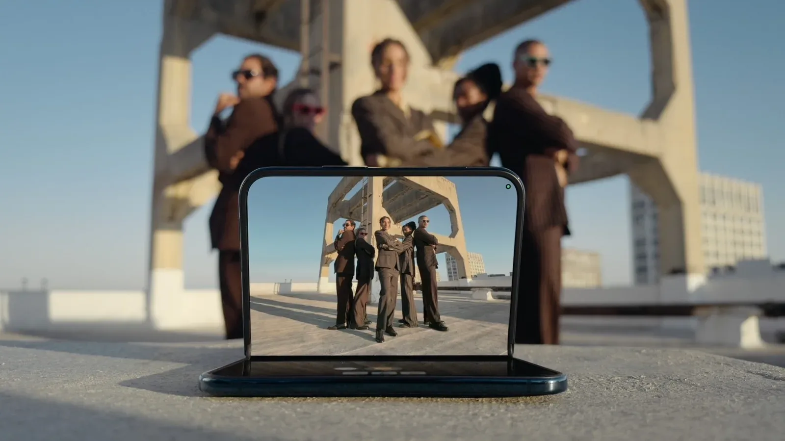 An iPhone Duo folded in tent mode for a group photo