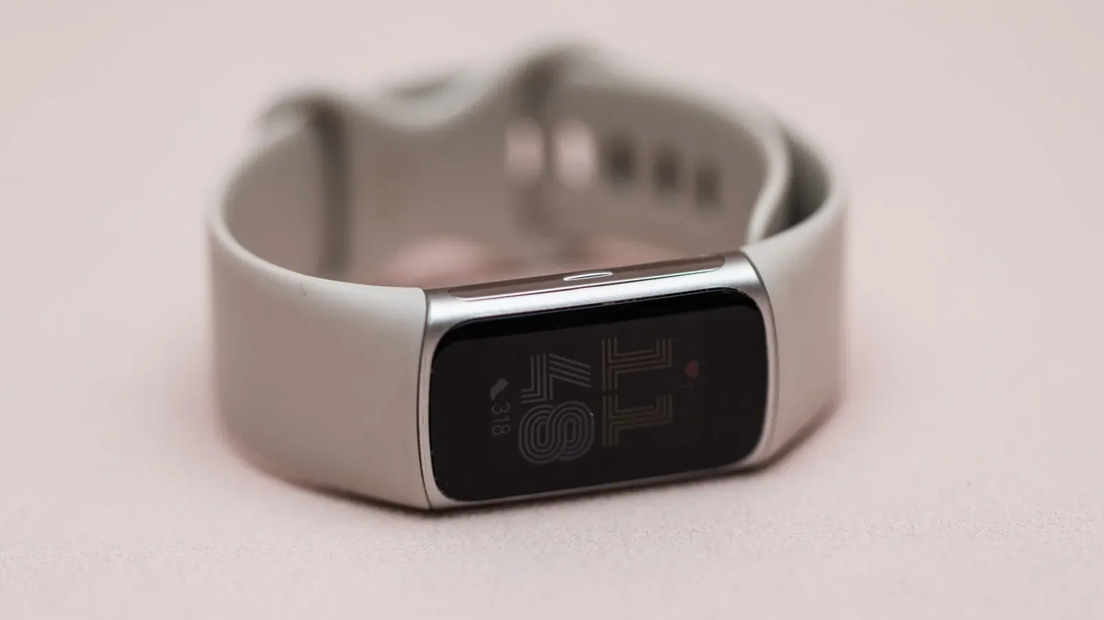 Google Fitbit Edge teaser showing what appears to be a side button on the wearable