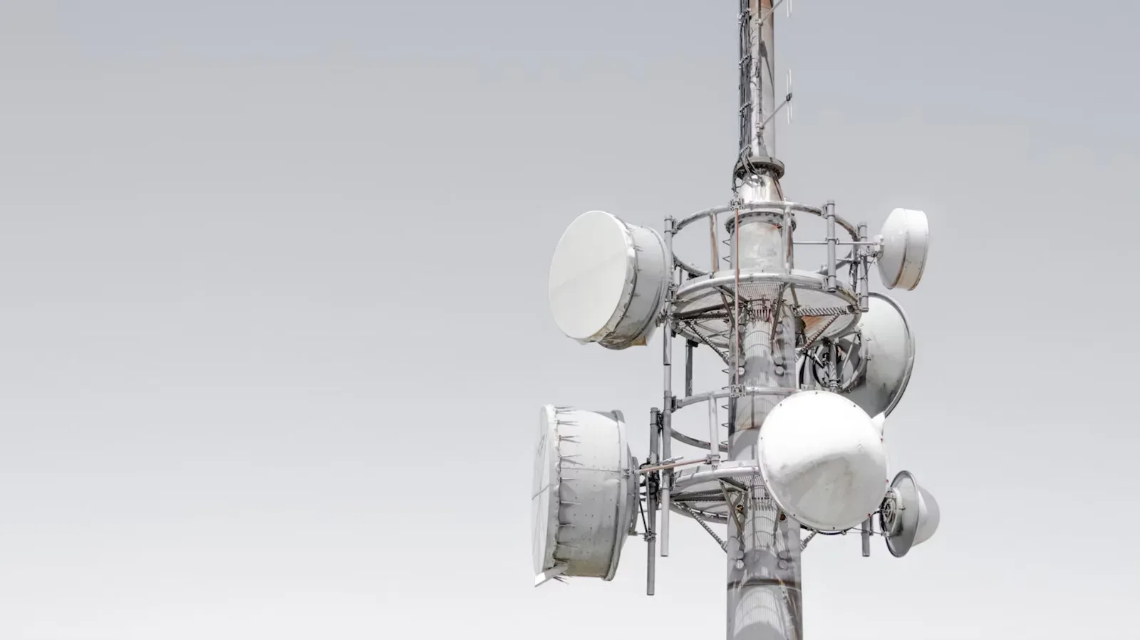 Illustration of a smartphone connecting to a satellite above a remote area
