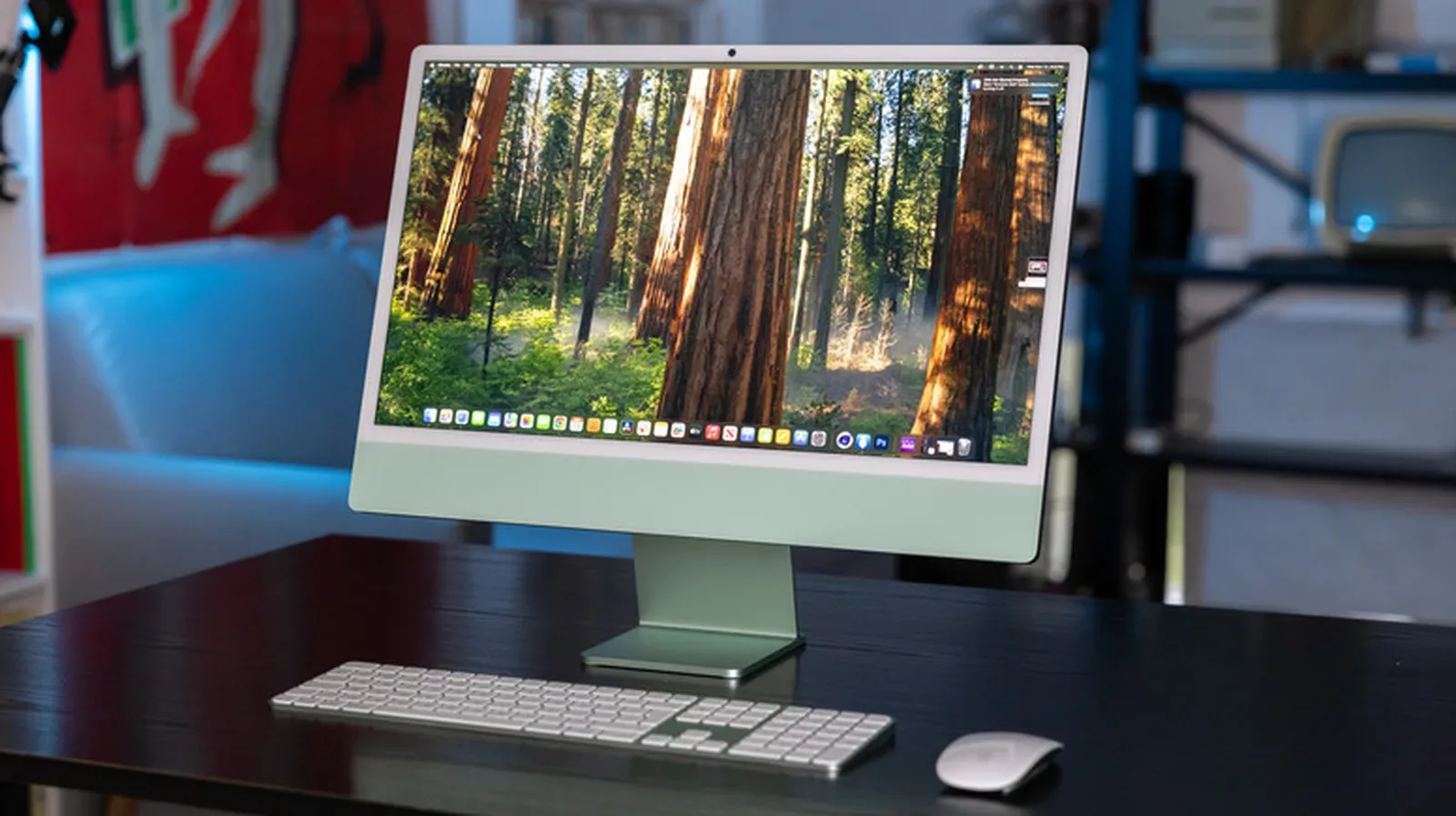 An all-in-one desktop computer on a tidy desk with keyboard and mouse