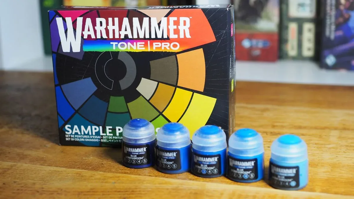 Warhammer Tone Pro paint and box on a wooden surface