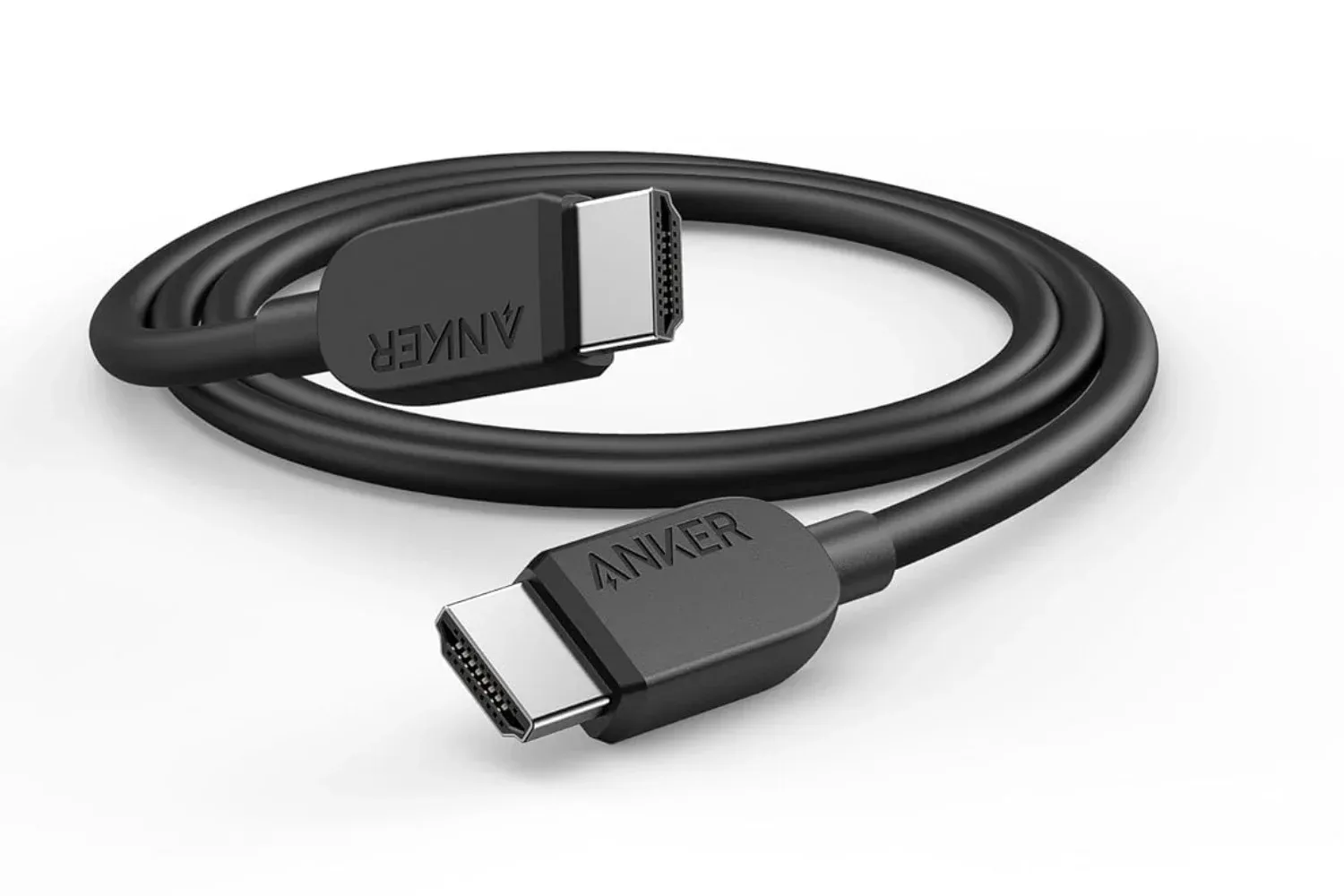 Anker HDMI 2.1 cable arranged beside a gaming monitor