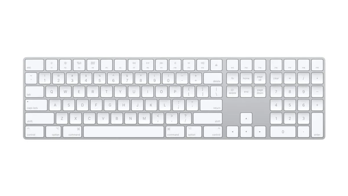 Apple Magic Keyboard with Numeric Keypad in white on a desk