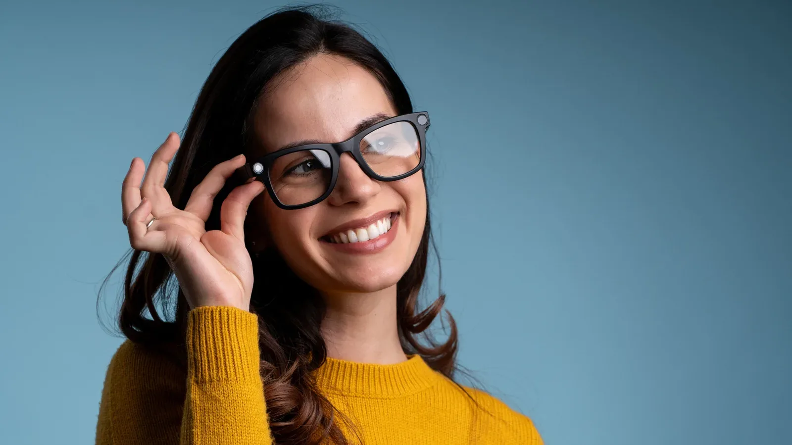 Camera-free AI glasses with open-ear speakers resting on a table