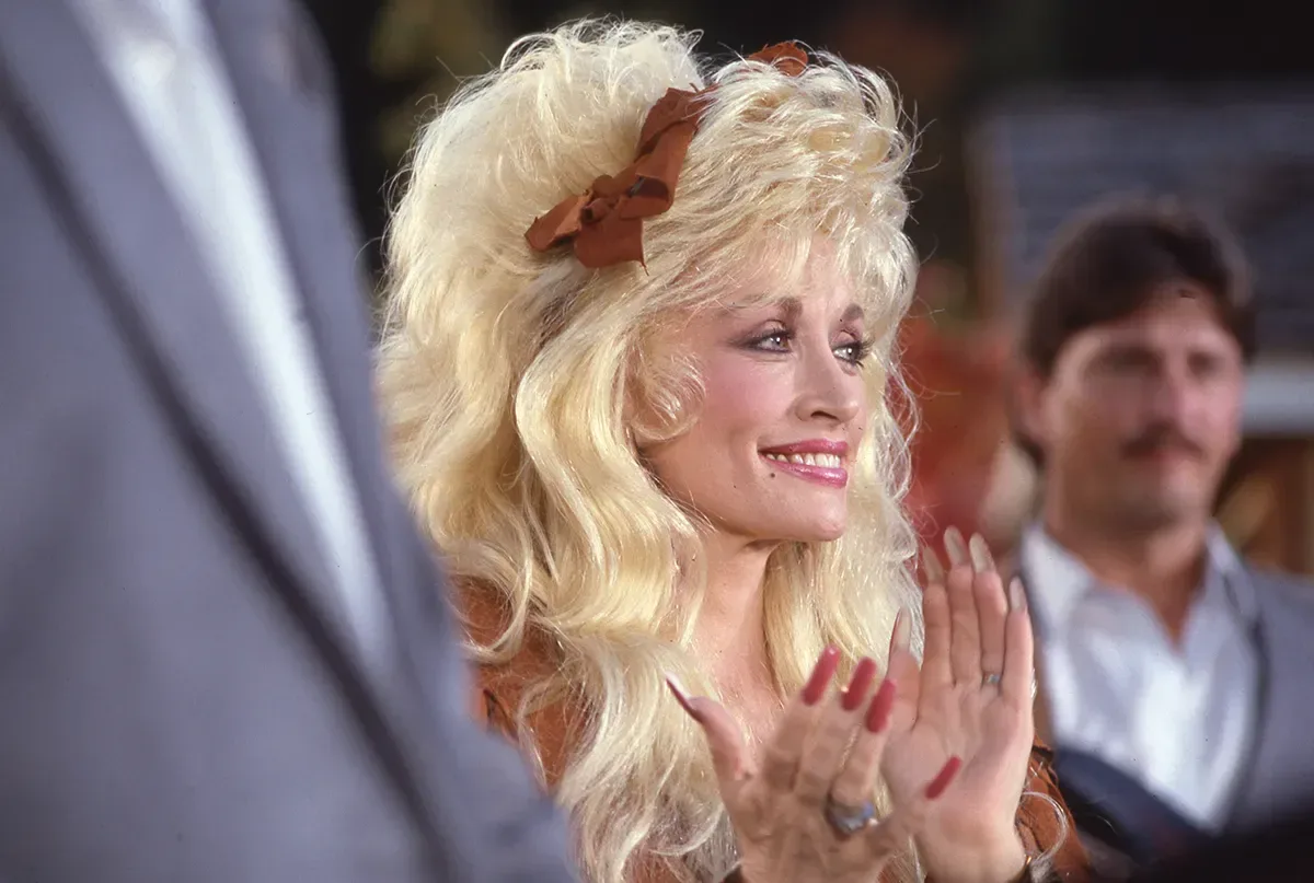 Dolly Parton tribute celebration featuring performers on a CMA stage