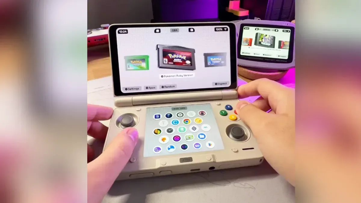Socket game library displayed across a dual-screen Android gaming handheld