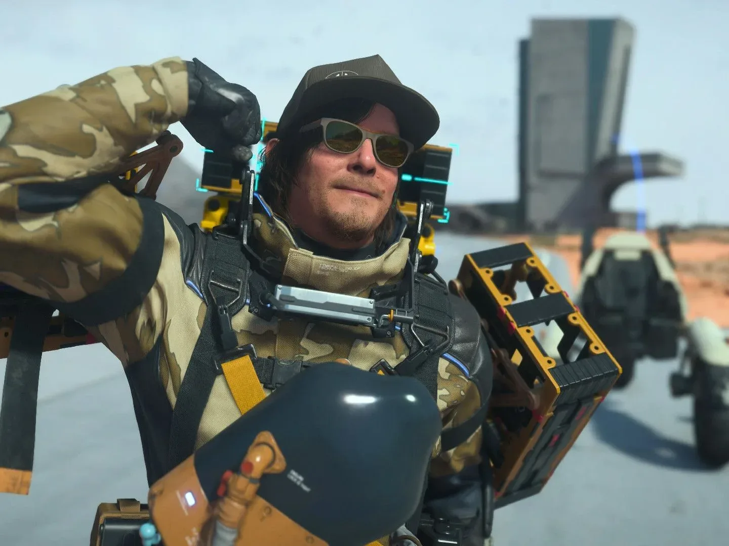Sam Porter Bridges flexes for the camera in Death Stranding 2