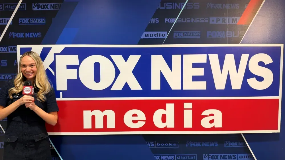 A smartphone displaying short-form news and creator video feeds