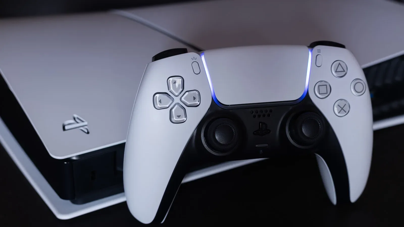 A PlayStation 5 console positioned beside a television